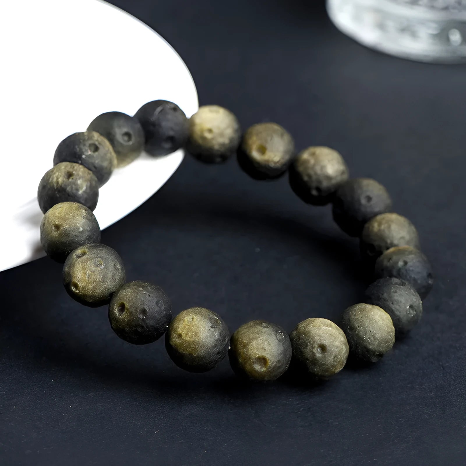 Natural crater ball bracelet featuring gold obsidian and silver stone meteorite beads in various sizes from 9mm to 16mm