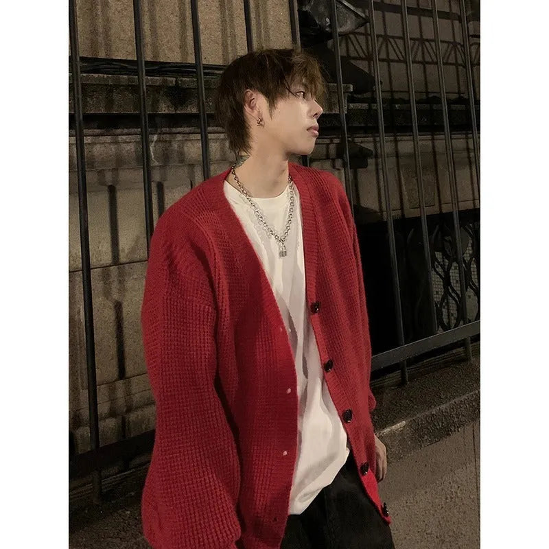 Men's loose V-neck cotton blend cardigan in army green, shown on a hanger.