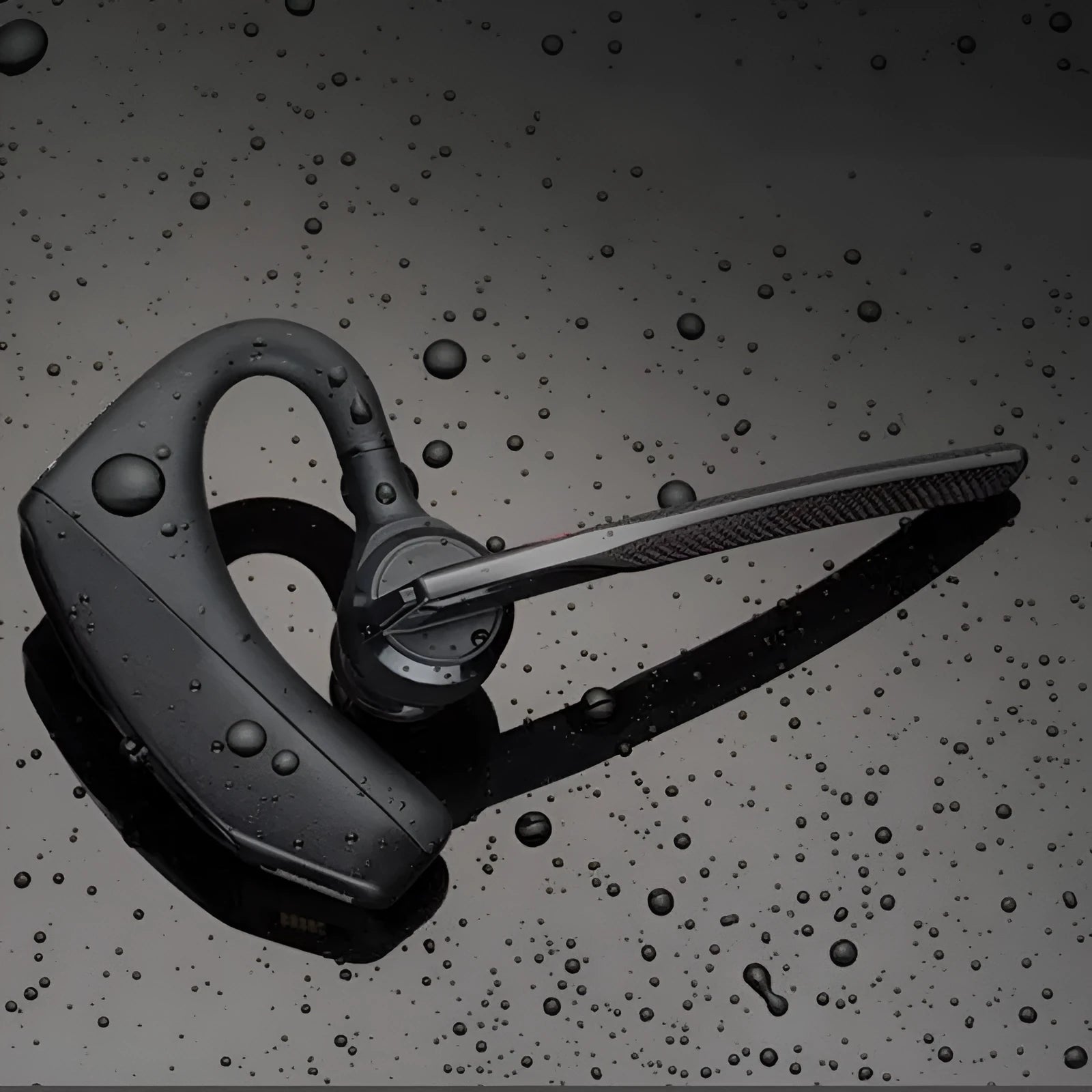 Black plastic Bluetooth sports headphones with a call function and battery display, shown with USB charging.