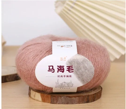 Single ball of mohair yarn in various colours for hand-woven DIY scarf knitting projects