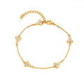 Women's stainless steel geometric triangle bracelet with a three-diamond pattern, shown in a gold and white zircon colour option.