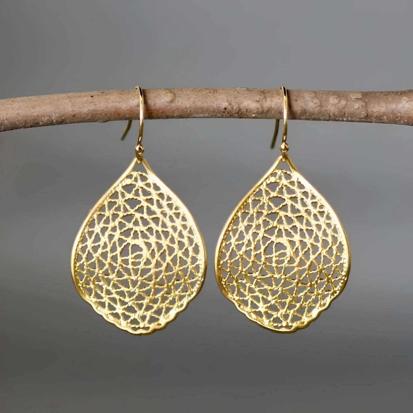 Gold retro leaf hollow drop pendant earrings with alloy construction