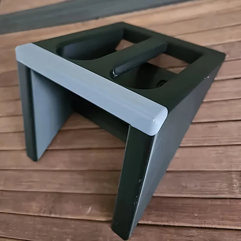 Black punk-style plastic pistol stand for airsoft and display models, measuring 10.85 by 7.6 cm.