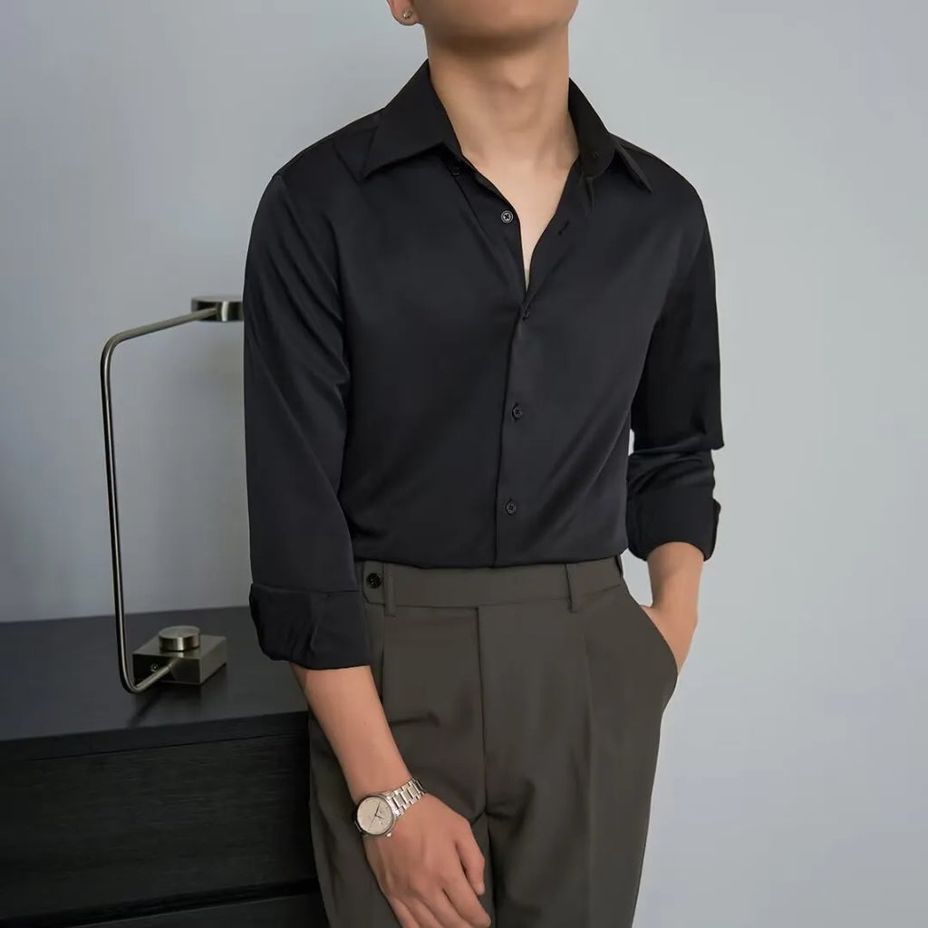 Man wearing a black loose-fit long sleeve cardigan shirt in Korean style.