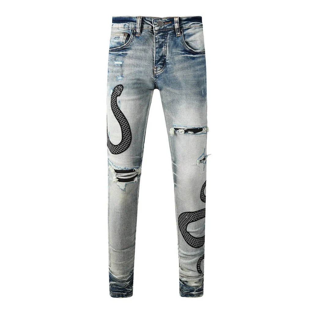 Blue distressed skinny jeans with a button fly on a mid waist, showing a slim fit and retro wash detail.