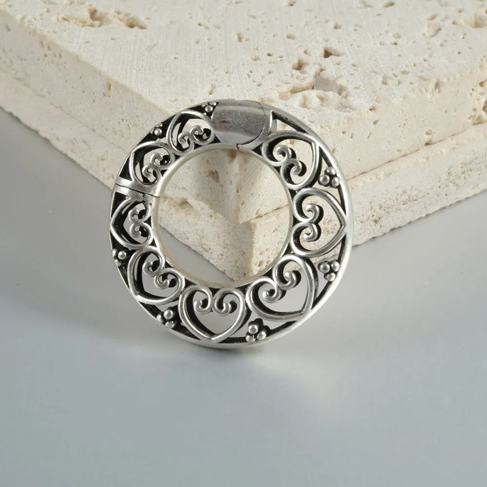 Retro hollow heart and lotus magnetic earrings in antique silver and gold finishes