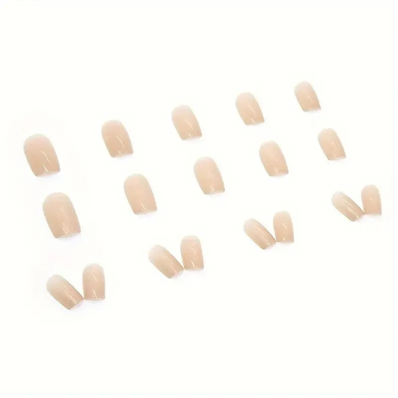 A set of solid light pink false nails (colour MY119) arranged on a card, showcasing their cute style and plastic construction.