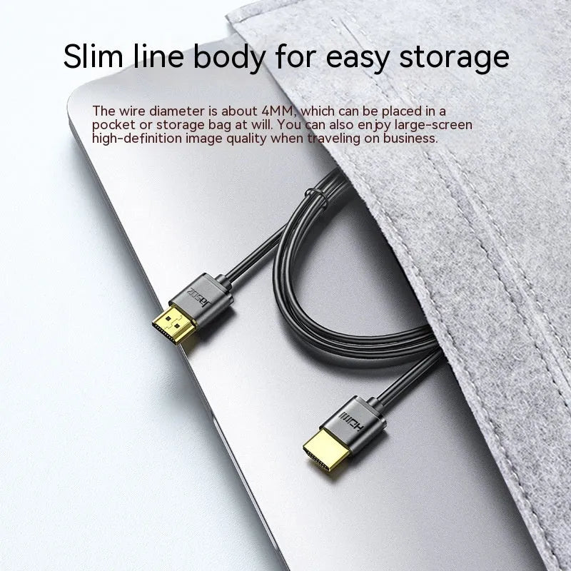 Gold-plated HDMI cable with thin black wire, shown with connector close-up highlighting contacts.
