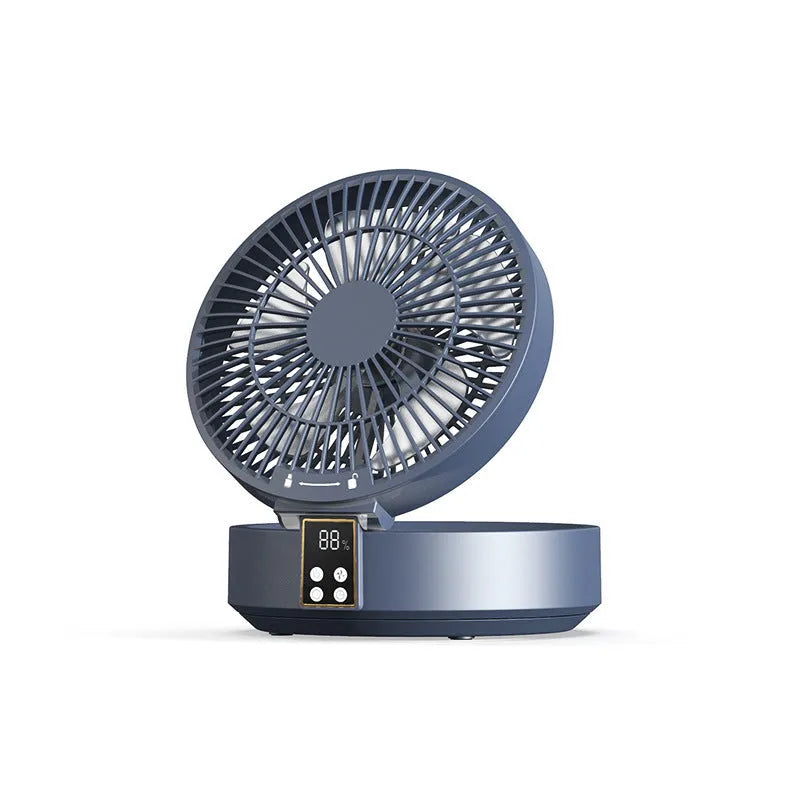 White portable folding desk fan with remote control and warm night light on a table
