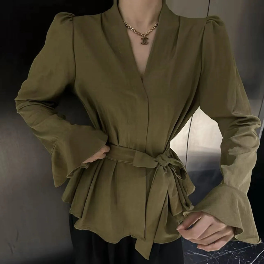 Women's French-style irregular collar long sleeve shirt with bell sleeves and a tie front.