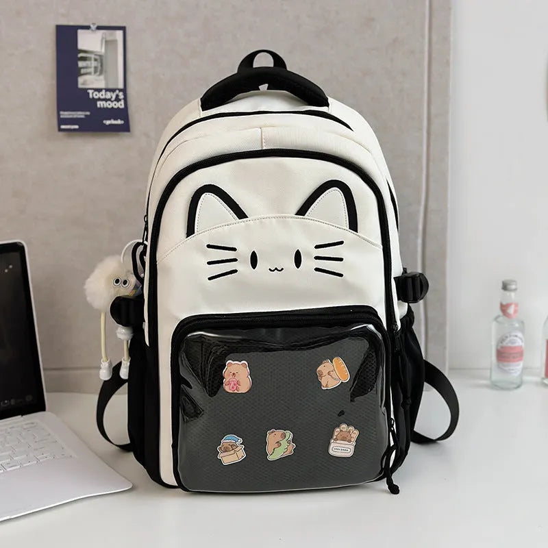 Korean cartoon large capacity nylon backpack in pink colour with badge pendant.