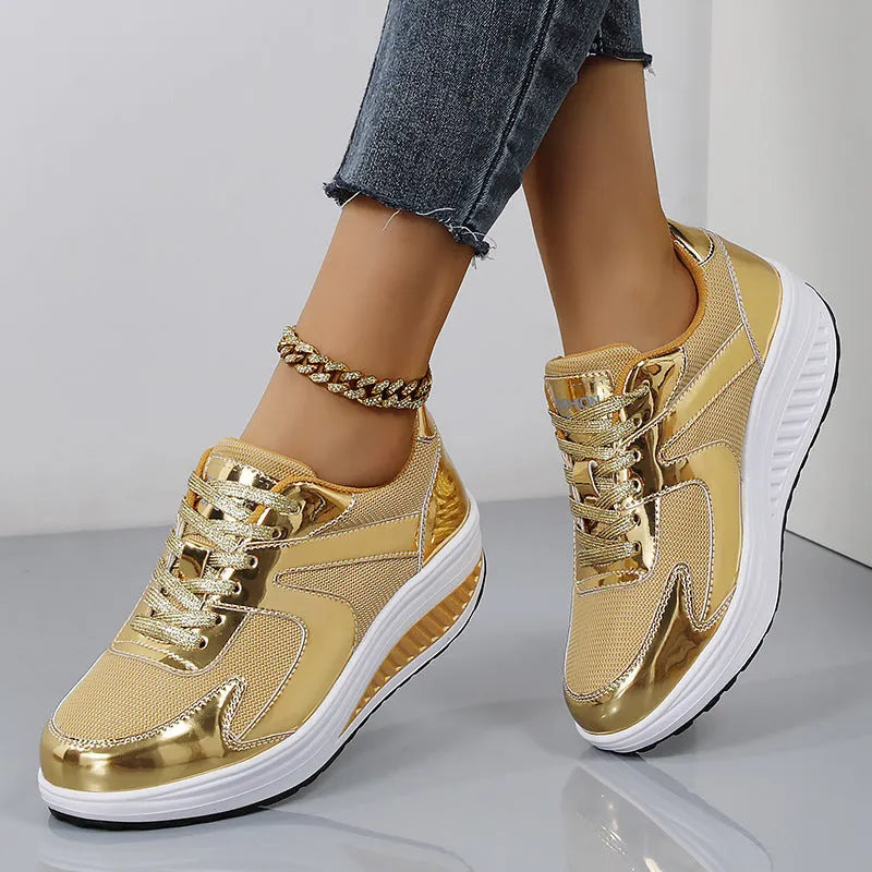 Women's gold platform shoes with mesh upper, round toe, and cross-strap detail