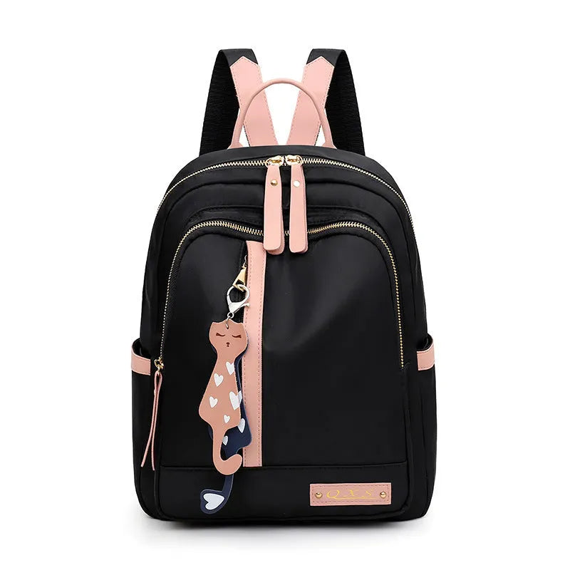 Women's black nylon backpack with waterproof lining and multiple zippered compartments