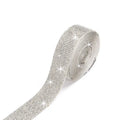 Self-adhesive glass rhinestone strip on a roll showing white and AB colour options.