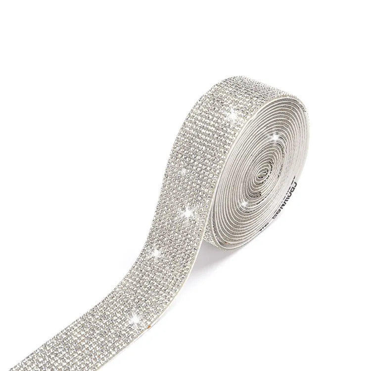 Self-adhesive glass rhinestone strip on a roll showing white and AB colour options.