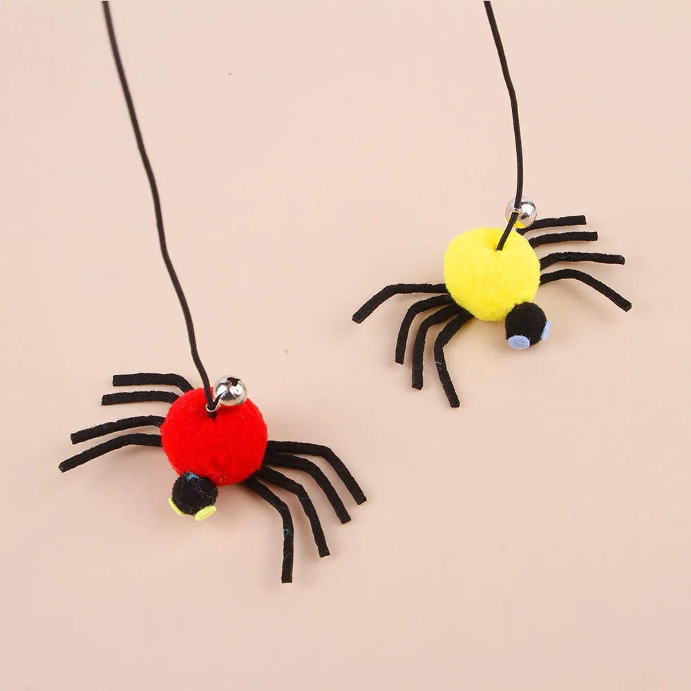 Cat door hanging toy with elastic rope, feather, bell, and spider design in red colour