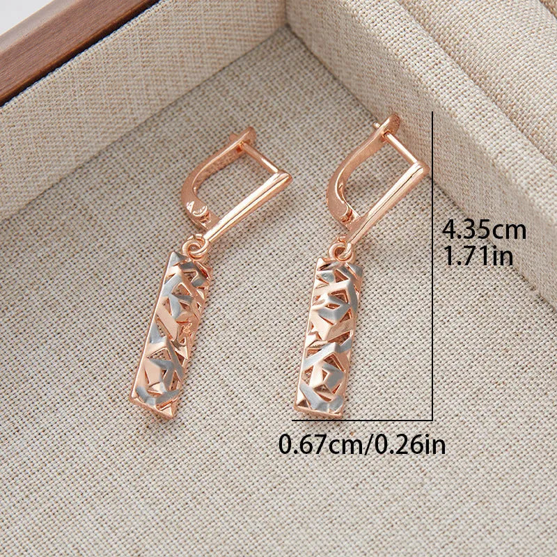 Rectangular two-tone hollow stud earrings with geometric openwork centre and electroplated finish