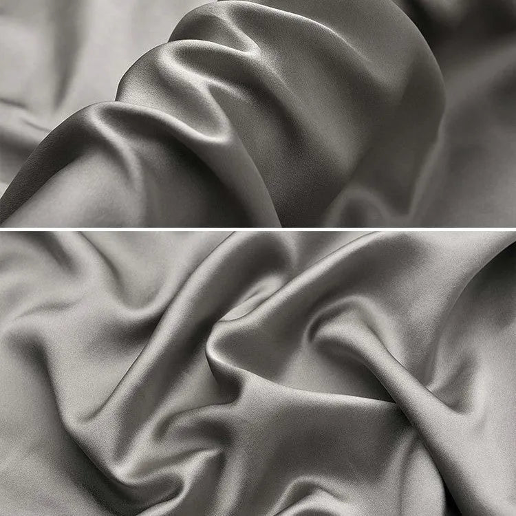 Dark grey silk pillowcase with envelope closure, shown flat and on a pillow.