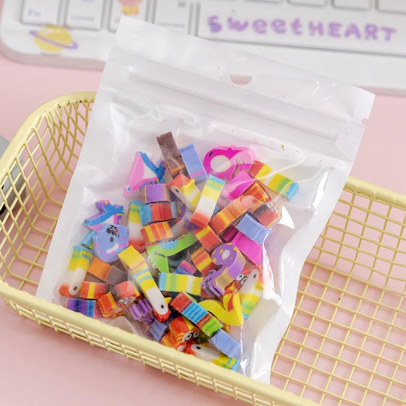 50 colourful cartoon mini erasers in pearlescent bags showing fruit, animal, and holiday designs