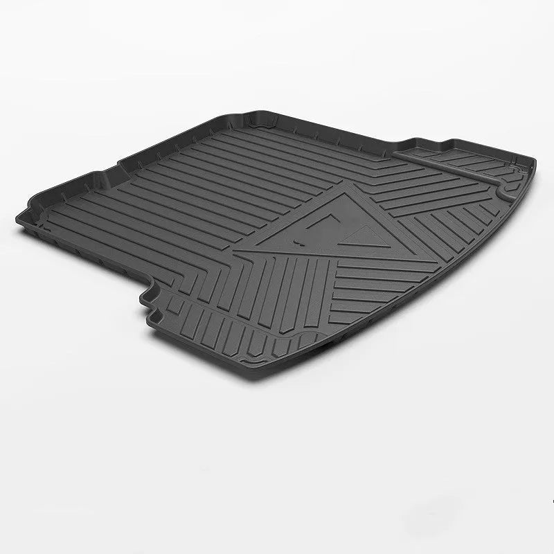 Black TPE car boot liner with carbon fibre pattern texture.