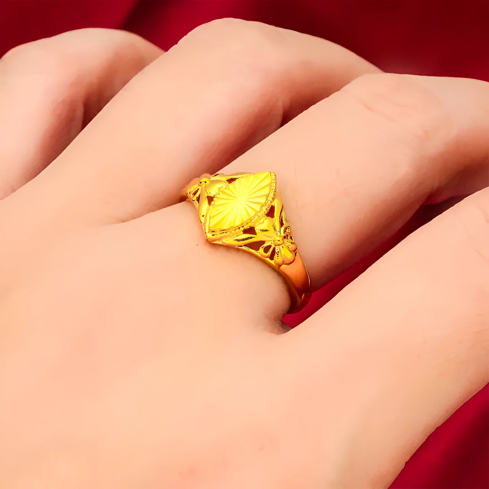 Gold geometric flower ring with textured brass construction and open diamond design