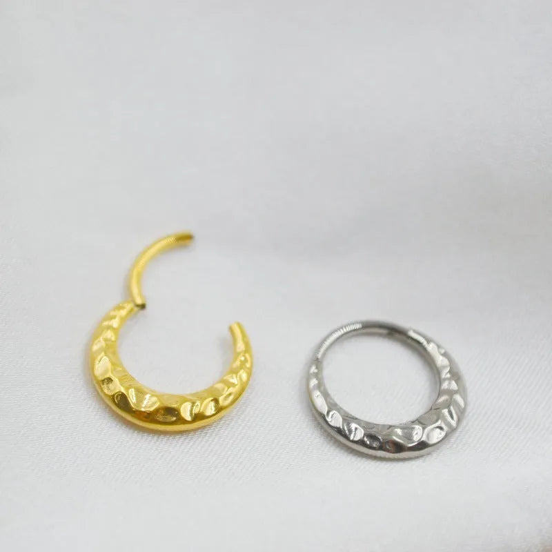 ASTM F136 titanium alloy nose ring with concave-convex carved design in gold or silver.