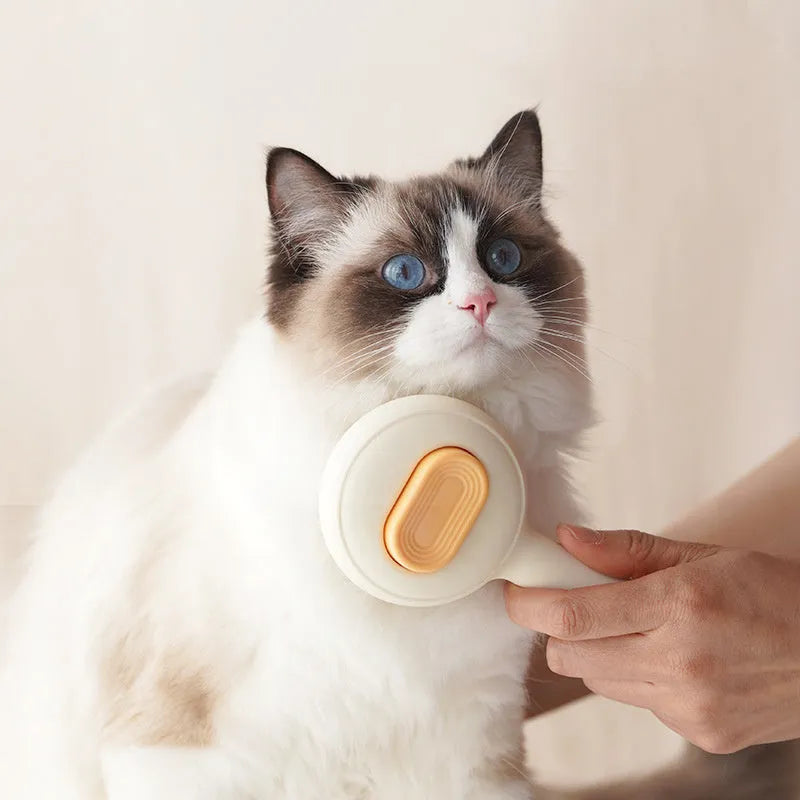 Green pet grooming brush with stainless steel pins and non-slip handle for cat and dog hair removal.