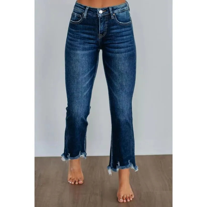 Women's dark blue cotton denim jeans with hand-distressed detailing and casual styling