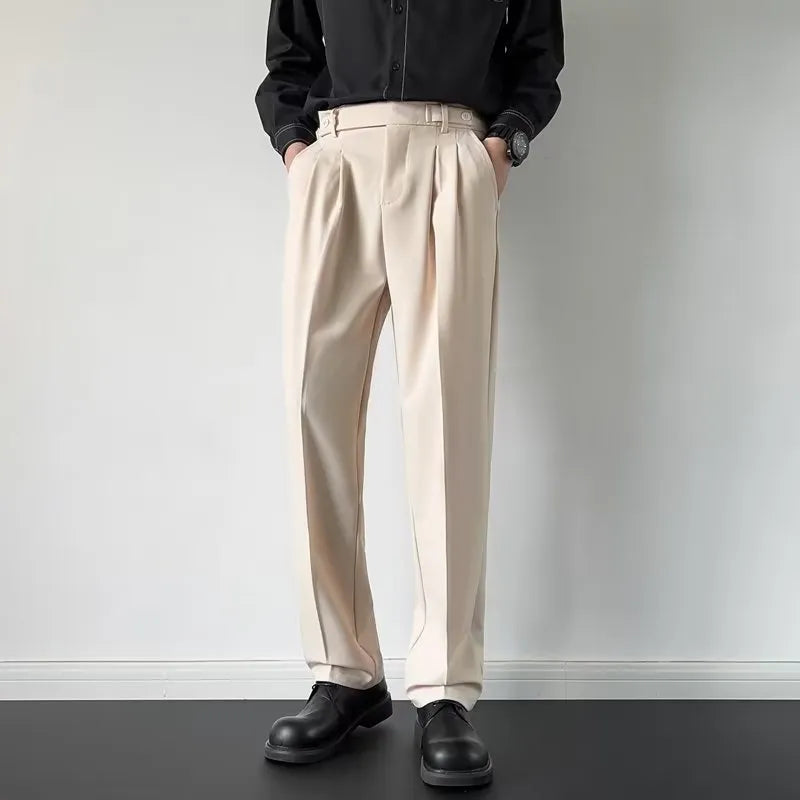 Men's straight cut loose fit suit trousers in apricot and black colours, made from polyester fabric.