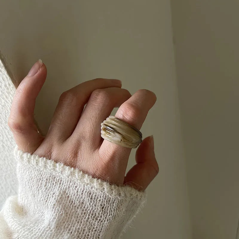 Geometric Chinese style resin ring in brown or white colour with irregular width design