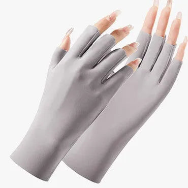 Thin beige women's sunscreen gloves with UPF50+ protection on a hand.