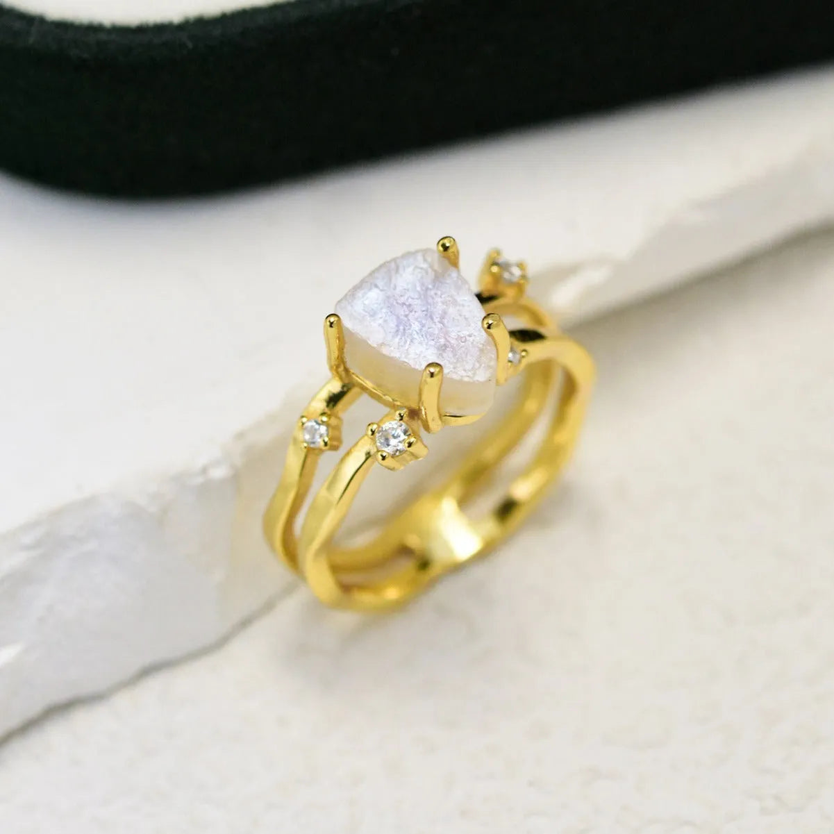 S925 silver ring with triangular shape and central moonstone in rose gold, white, or yellow gold finish.