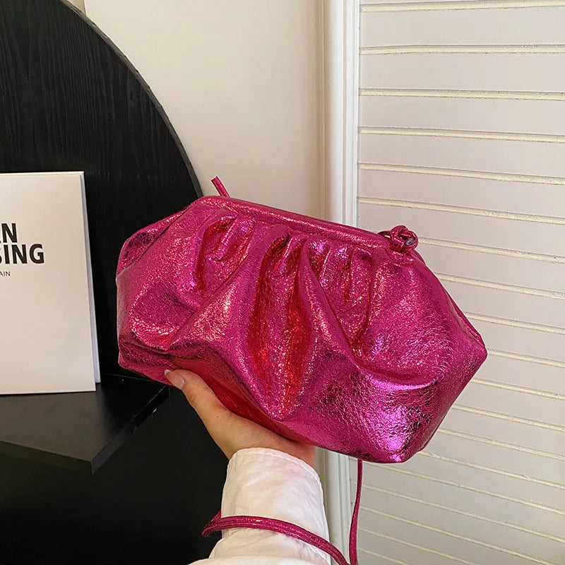 Simple hair clip shoulder crossbody bag in shell shape with sewing line details, shown in rose red colour.