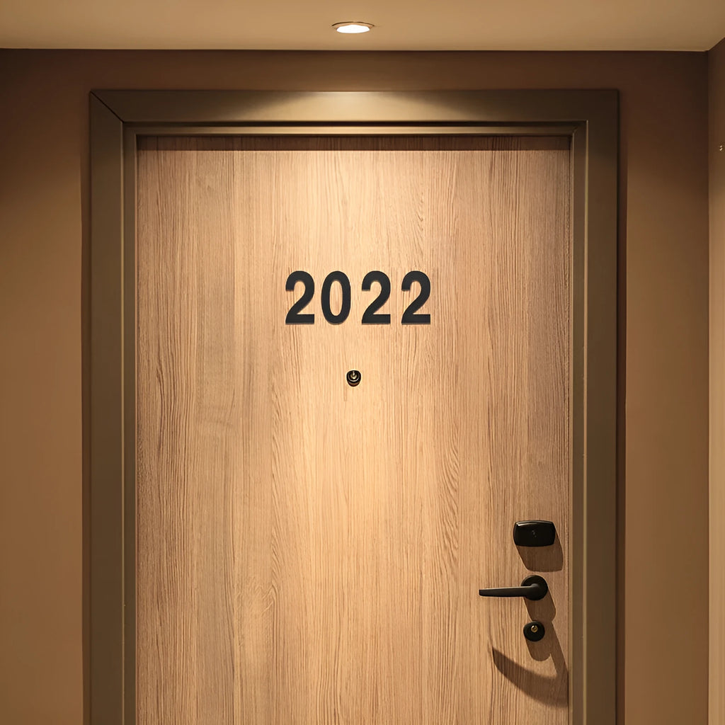 Black stainless steel adhesive house number plate, 7.5cm tall, with separate letters and numbers.