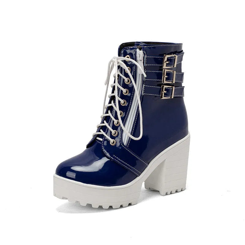 Women's black thick-heeled lace-up ankle boots with a round toe and rubber sole on a waterproof platform.