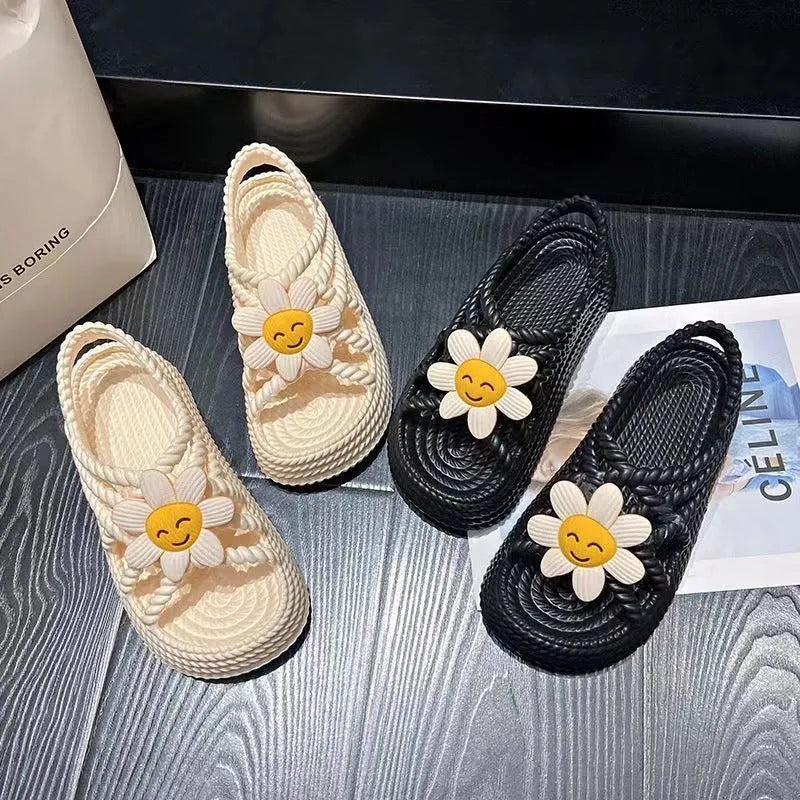 Women's floral decorated PVC sandals in beige or black with non-slip soles