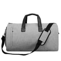Light grey oval travel bag with multiple internal compartments for organisation.