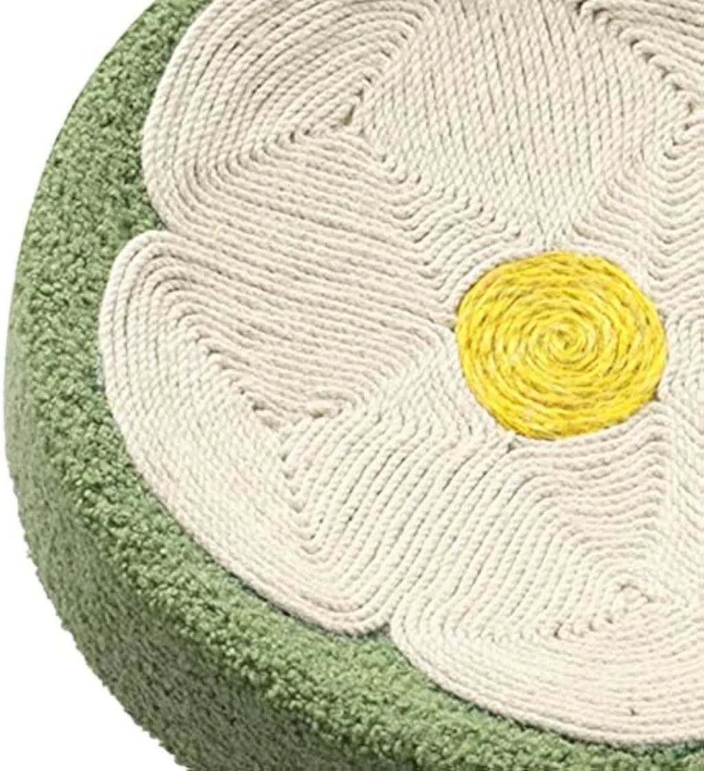 Green round sisal cat scratcher bowl lounge bed for kittens on a floor.