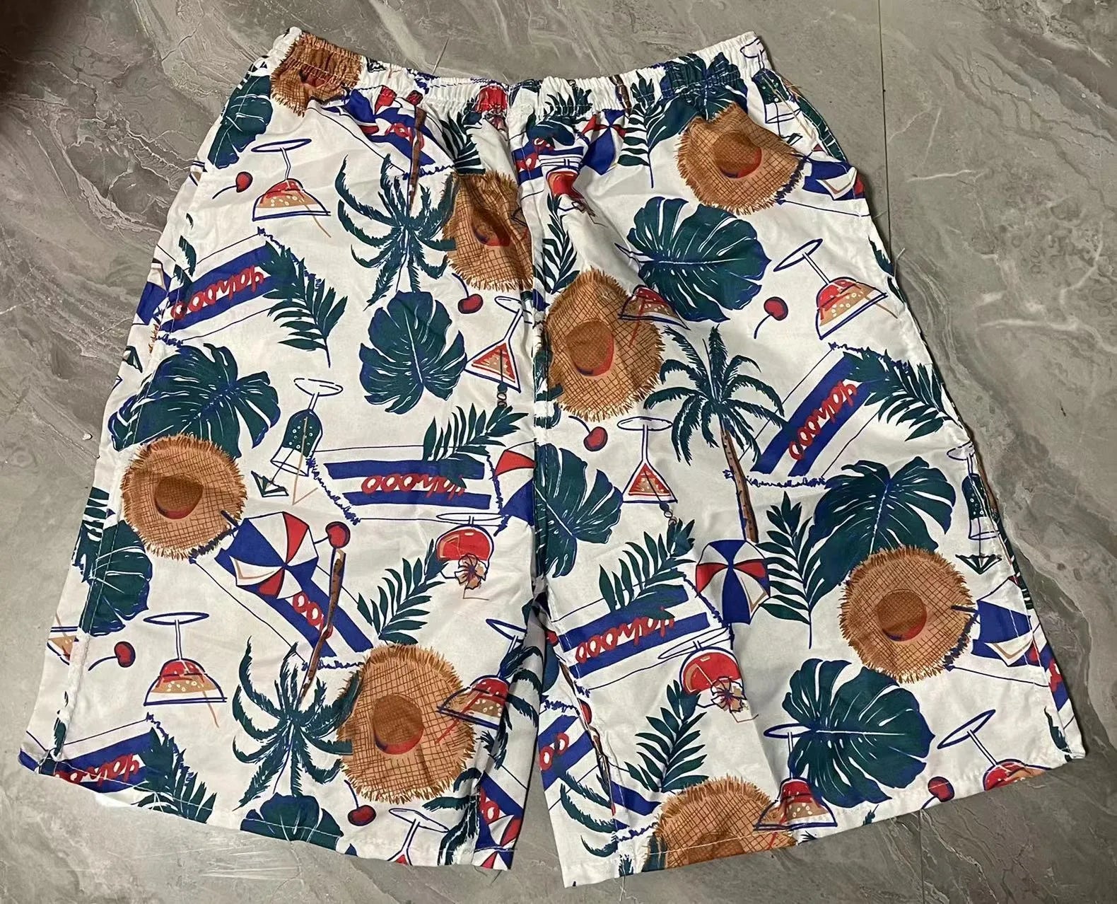 Men's floral print swimming trunks in multiple colour patterns with five-point design