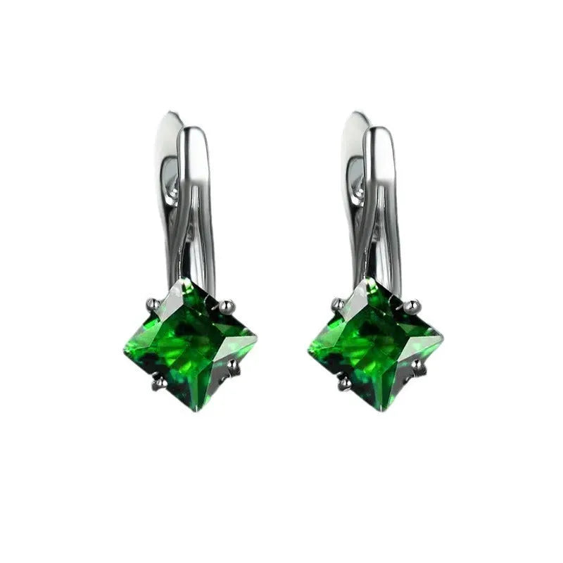 A pair of women's copper earrings with an inlaid zircon diamond design, shown in blue, green, and colour variations.