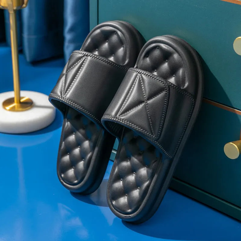 Soft EVA non-slip bathroom slippers with thick sole in assorted colours on a bathroom floor.