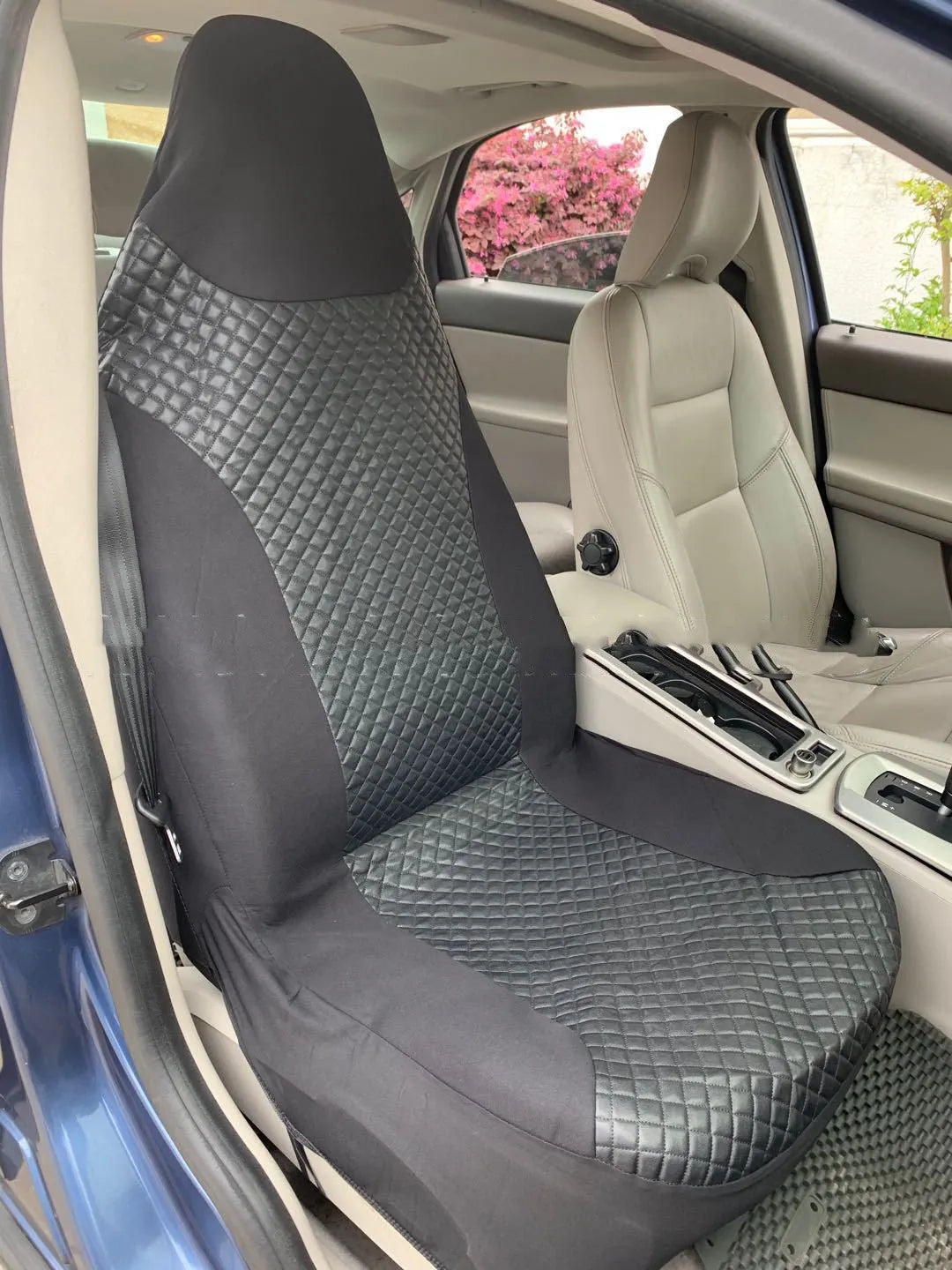 Black quilted universal car seat cover made from PU and polyester fabric with sponge composite.