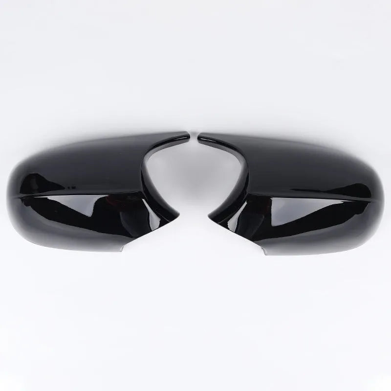Pair of black ABS plastic rearview mirror housings for BMW 3 Series E90 on a white background.