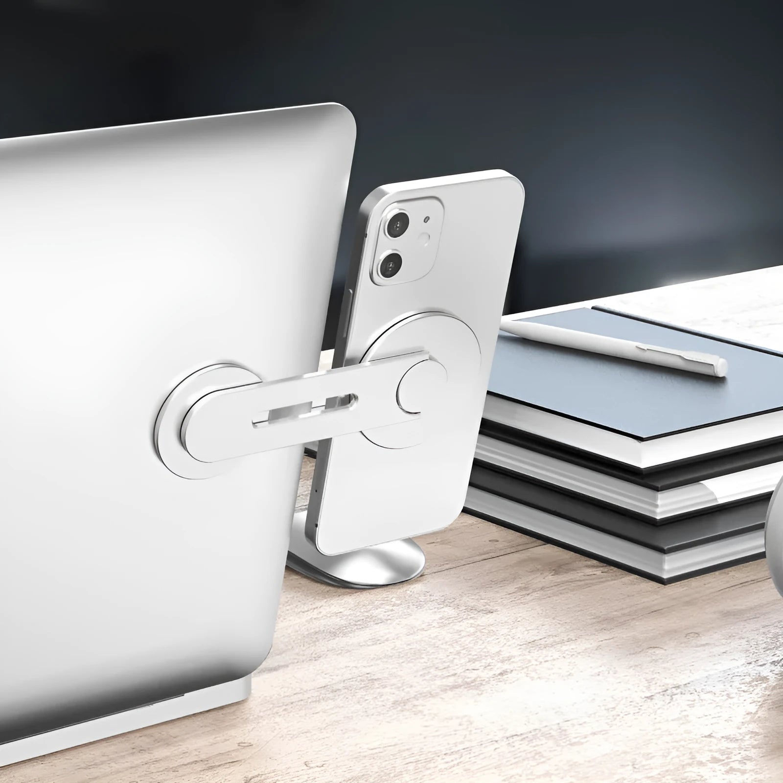 Silver aluminium alloy magnetic phone holder for car, shown next to its packaging box.