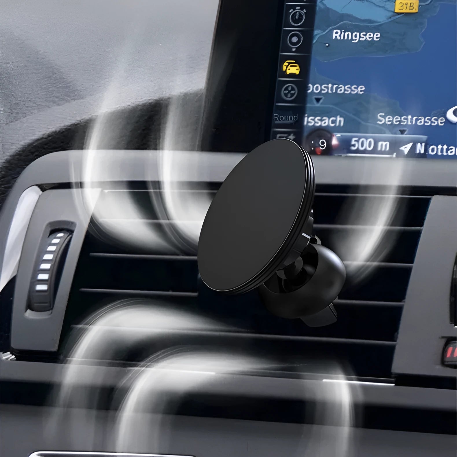 Black aluminium magnetic car phone holder clipped to car air vent