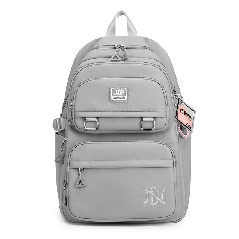 Large purple girls' nylon school backpack with a physiological curve backpanel on a white background.