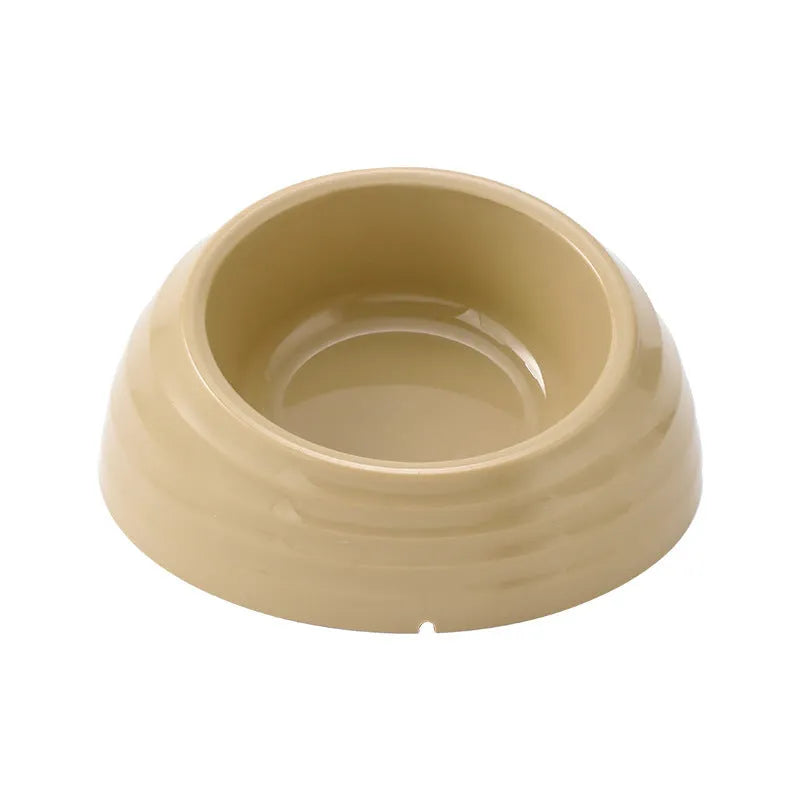 Stainless steel cat bowl on a plastic base in beige, brown, or light green.