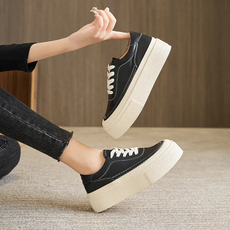 Women's black platform sports board shoes with embossed cowhide upper and tie fastening