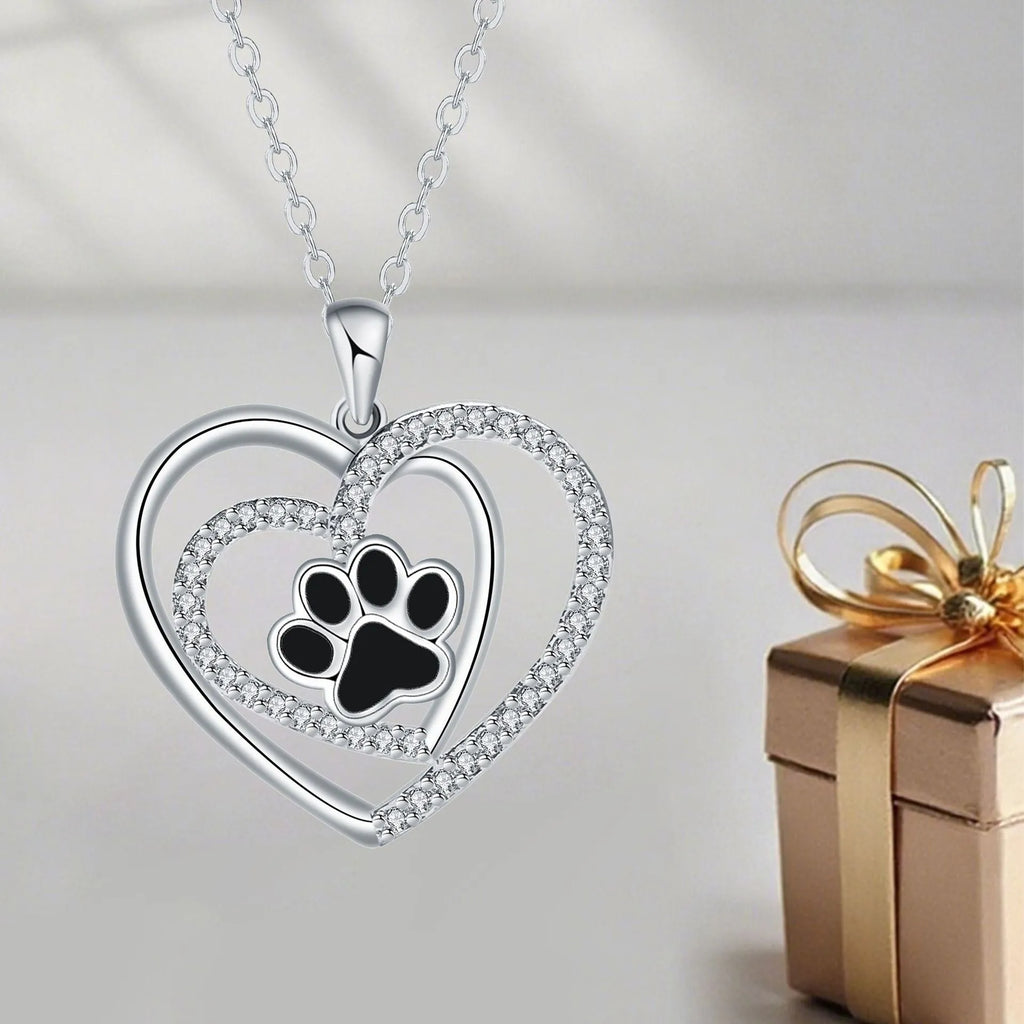 Women's copper necklace with dog's paw footprints and heart-shaped pendant on cross chain