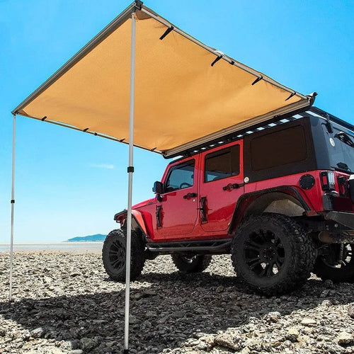 Camping tent sunshade with aluminium poles and camouflage or black glue style, set up outdoors.